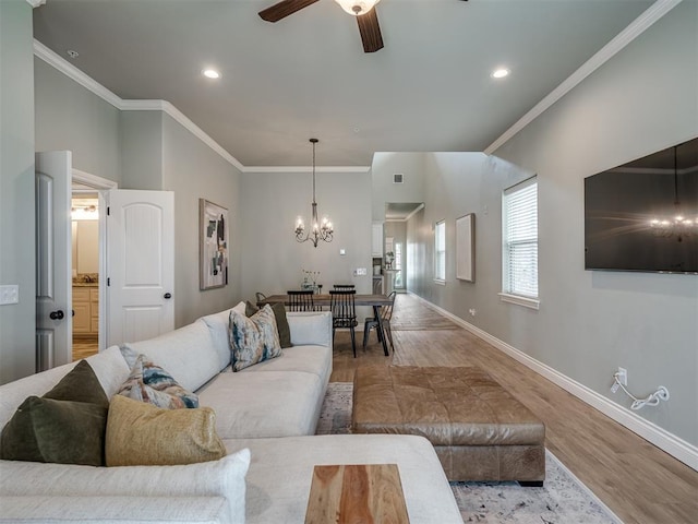 4800 Stelens Ct, Norman, OK 73071 - living area featuring wood finished floors, ceiling fan, a chandelier, ornamental molding, and recessed lighting