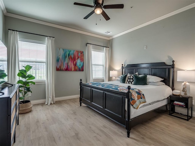 4800 Stelens Ct, Norman, OK 73071 - bedroom featuring light wood-style flooring, multiple windows, crown molding, and ceiling fan