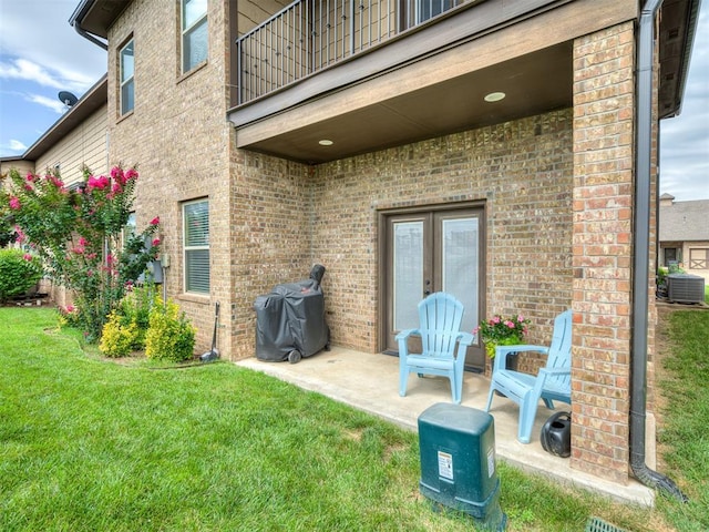 4800 Stelens Ct, Norman, OK 73071 - patio / terrace with french doors, grilling area, a lawn, and a patio area