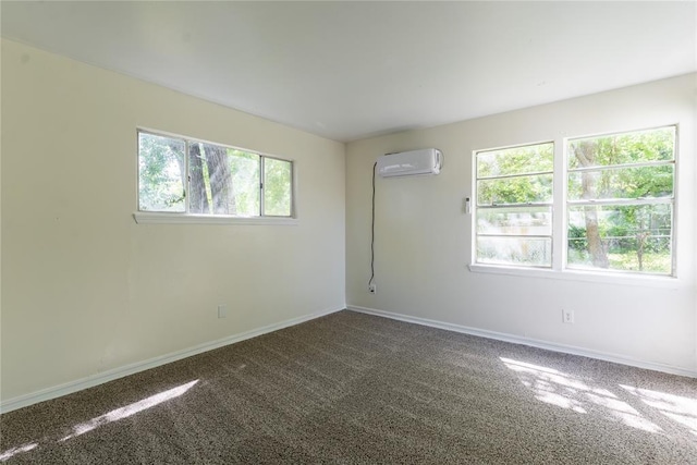 3820 SE 23rd St, Del City, OK 73115 - carpeted spare room featuring a wall mounted air conditioner and baseboards
