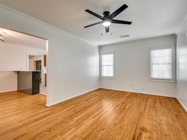 500 Dakota St, Norman, OK 73069 - unfurnished room with ornamental molding, light wood-type flooring, and a ceiling fan