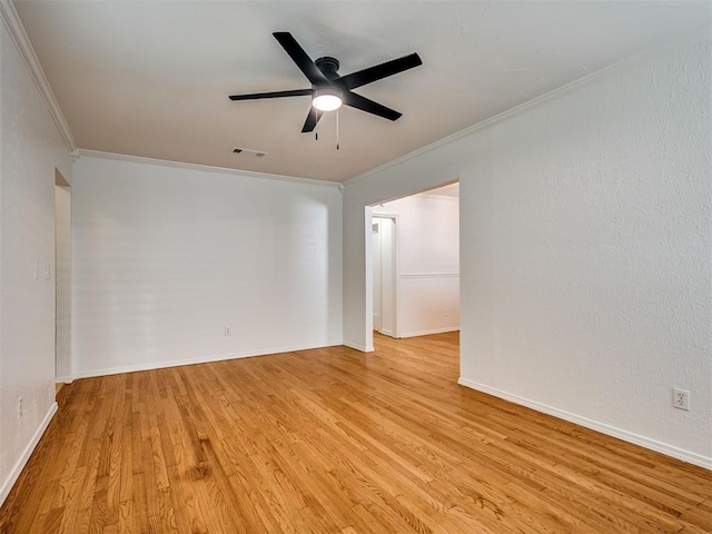 500 Dakota St, Norman, OK 73069 - spare room with crown molding, light wood-style floors, and ceiling fan