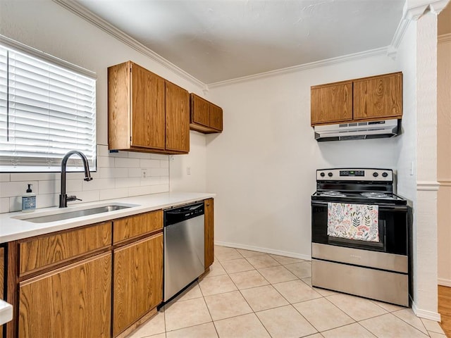 500 Dakota St, Norman, OK 73069 - kitchen featuring appliances with stainless steel finishes, ventilation hood, brown cabinets, and crown molding