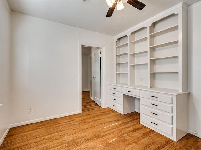 500 Dakota St, Norman, OK 73069 - unfurnished office with ceiling fan, built in desk, and light wood-style floors