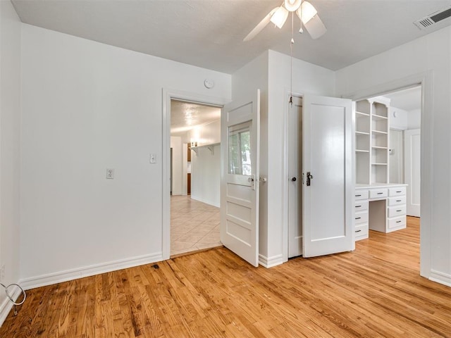 500 Dakota St, Norman, OK 73069 - unfurnished bedroom with light wood-style floors and a ceiling fan