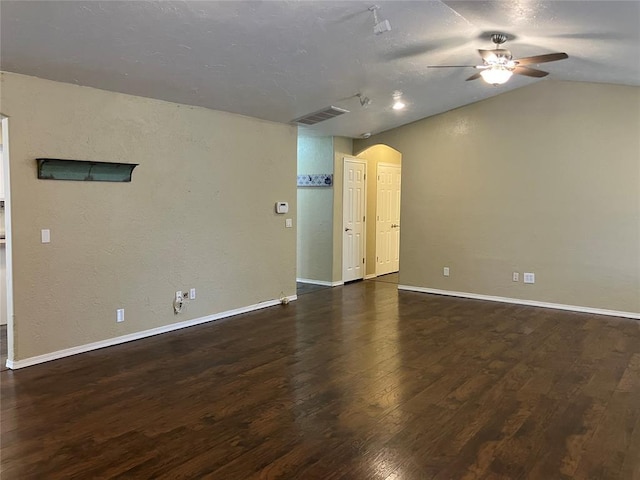 9105 Oak Creek Dr, Midwest City, OK 73130 - unfurnished room featuring arched walkways, a ceiling fan, wood finished floors, and lofted ceiling