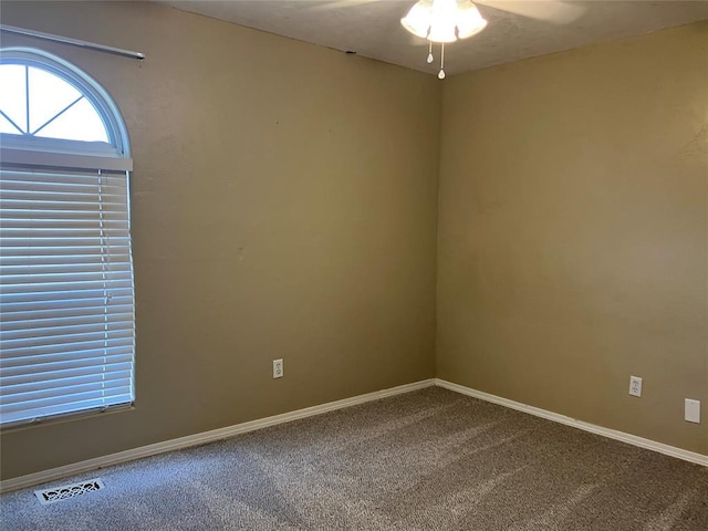 9105 Oak Creek Dr, Midwest City, OK 73130 - carpeted empty room featuring ceiling fan and baseboards