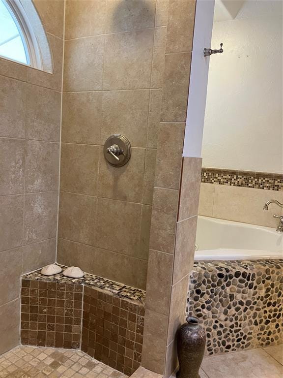 9105 Oak Creek Dr, Midwest City, OK 73130 - bathroom featuring a garden tub, tiled shower, and tile patterned flooring