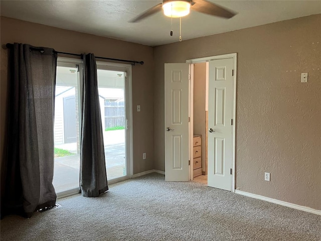 9105 Oak Creek Dr, Midwest City, OK 73130 - carpeted empty room with a ceiling fan and a textured wall
