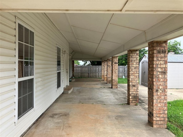 9105 Oak Creek Dr, Midwest City, OK 73130 - view of patio / terrace featuring a shed
