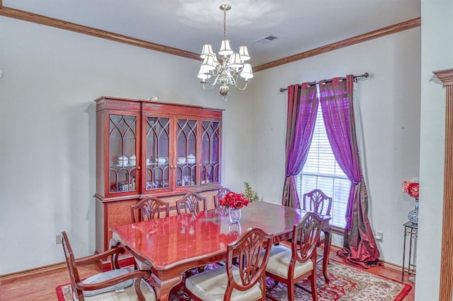 645 SW 160th St, Oklahoma City, OK 73170 - dining space with ornamental molding, a chandelier, and wood finished floors
