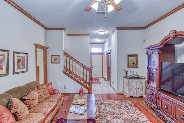 645 SW 160th St, Oklahoma City, OK 73170 - living area featuring crown molding, a ceiling fan, wood finished floors, and stairway