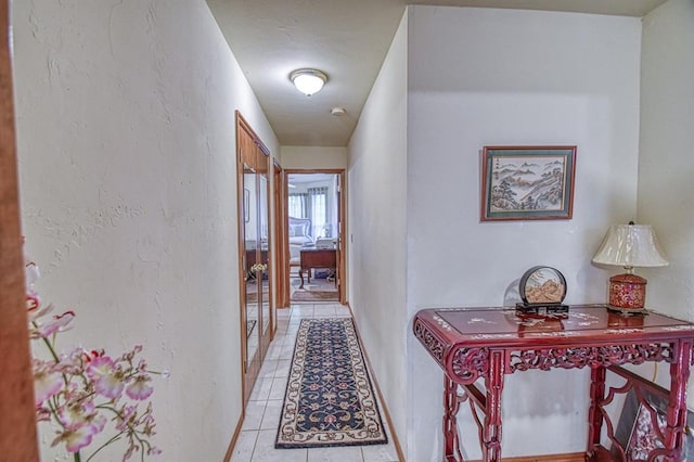 645 SW 160th St, Oklahoma City, OK 73170 - hallway featuring light tile patterned floors and baseboards