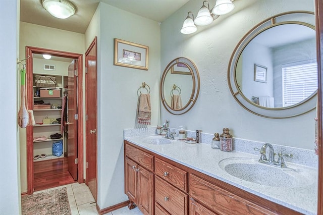 645 SW 160th St, Oklahoma City, OK 73170 - bathroom featuring double vanity and tile patterned floors