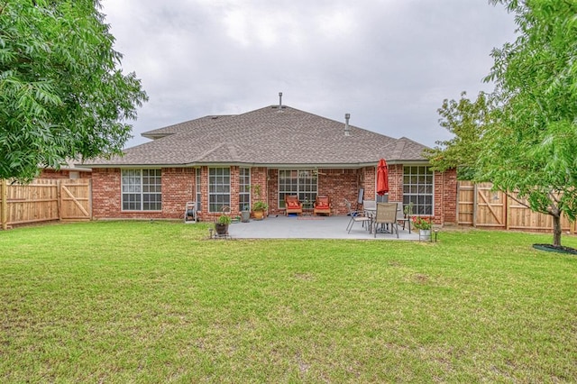 645 SW 160th St, Oklahoma City, OK 73170 - rear view of property with a fenced backyard, a patio, brick siding, and roof with shingles