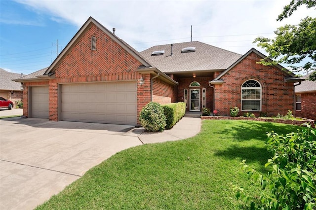 9024 NW 79th Ter, Yukon, OK 73099 - view of front of house featuring a garage, driveway, brick siding, and a front yard