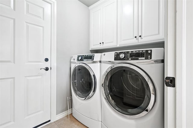 9024 NW 79th Ter, Yukon, OK 73099 - laundry room with cabinet space, washer and dryer, and light tile patterned floors