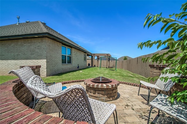 14812 Deerbrook Blvd, Oklahoma City, OK 73142 - fenced backyard featuring a fire pit, a patio area, and a pergola