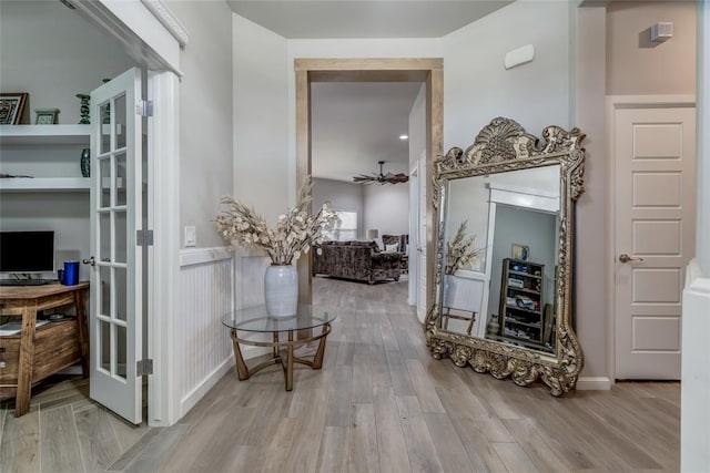 14812 Deerbrook Blvd, Oklahoma City, OK 73142 - hall featuring wood finished floors, a wainscoted wall, and french doors