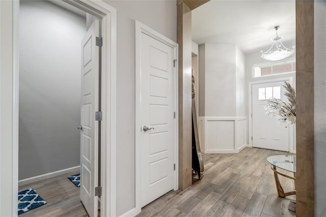 14812 Deerbrook Blvd, Oklahoma City, OK 73142 - hall featuring a chandelier and wood finished floors