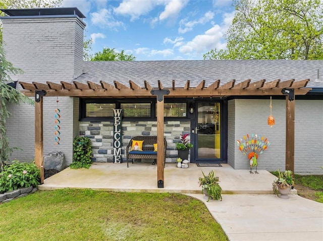 1800 SW 6th St, Ardmore, OK 73401 - view of exterior entry with a patio, a pergola, and a shingled roof