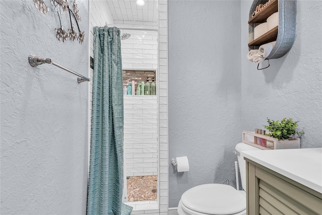 1800 SW 6th St, Ardmore, OK 73401 - bathroom featuring a textured wall, tiled shower, and vanity