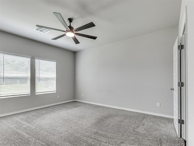 4205 Palmetto Bluff Dr, Mustang, OK 73064 - spare room featuring ceiling fan and carpet