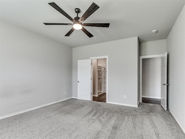 4205 Palmetto Bluff Dr, Mustang, OK 73064 - unfurnished bedroom with carpet flooring, a ceiling fan, and connected bathroom