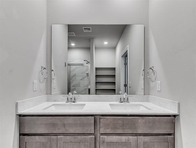 4205 Palmetto Bluff Dr, Mustang, OK 73064 - full bathroom featuring double vanity and a shower stall
