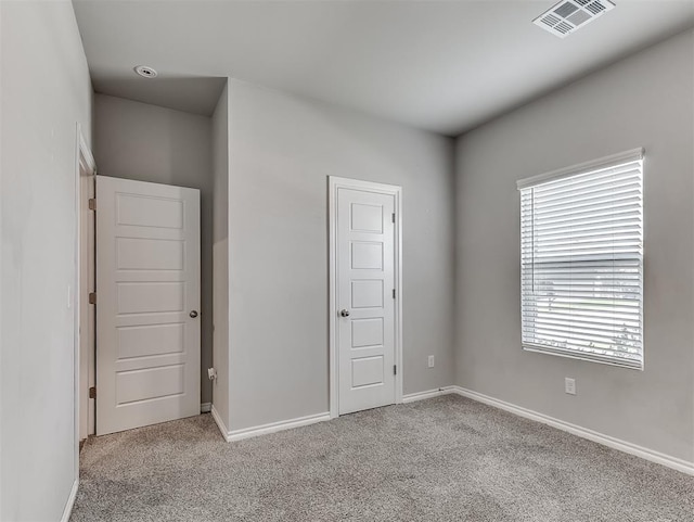 4205 Palmetto Bluff Dr, Mustang, OK 73064 - unfurnished bedroom featuring carpet and baseboards
