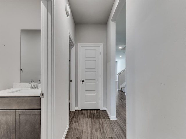 4205 Palmetto Bluff Dr, Mustang, OK 73064 - corridor with wood finished floors and a sink