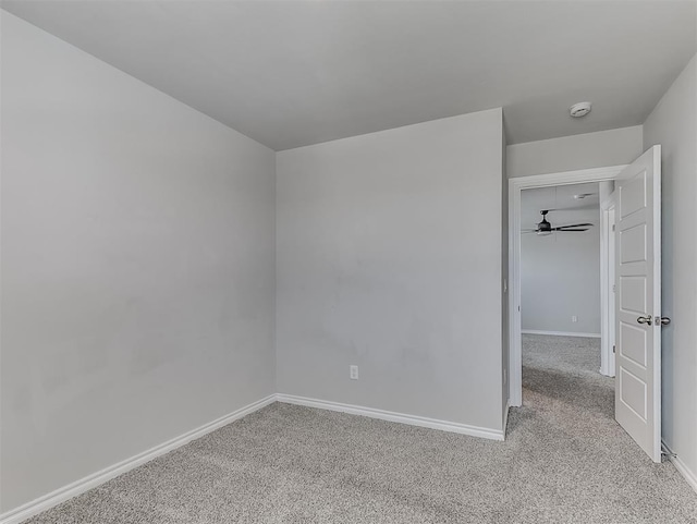 4205 Palmetto Bluff Dr, Mustang, OK 73064 - carpeted empty room featuring baseboards and a smoke detector