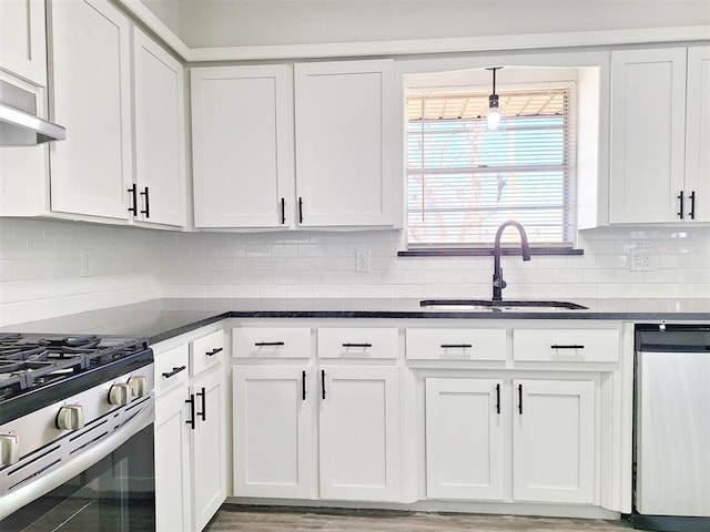 4713 Meench Dr, Del City, OK 73115 - kitchen with stainless steel appliances, white cabinetry, tasteful backsplash, and range hood