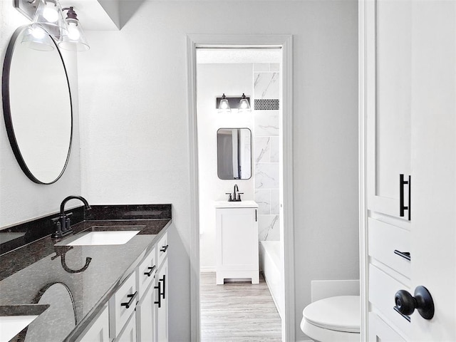 4713 Meench Dr, Del City, OK 73115 - full bath featuring double vanity and wood finished floors