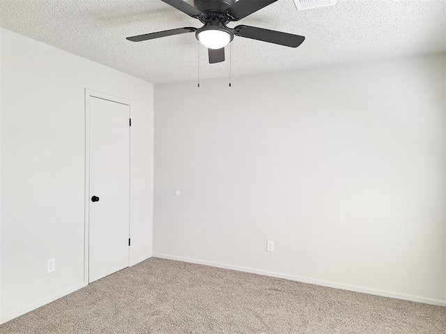 4713 Meench Dr, Del City, OK 73115 - carpeted spare room with a ceiling fan and a textured ceiling