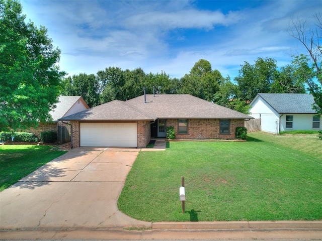 17 Pueblo, Edmond, OK 73013 - single story home with a garage, driveway, and brick siding