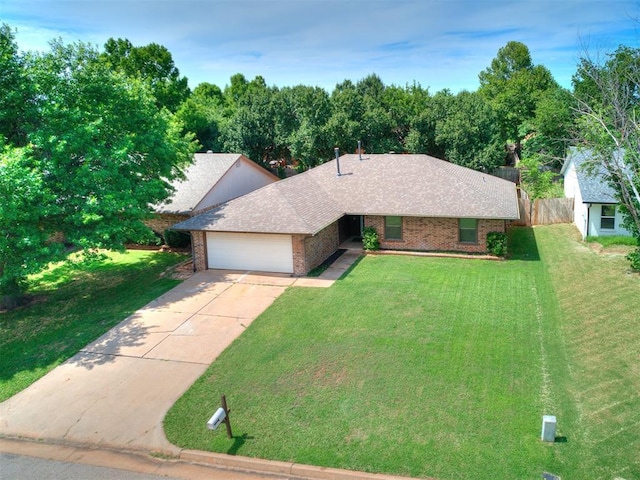 17 Pueblo, Edmond, OK 73013 - view of front of property featuring brick siding, a garage, and driveway