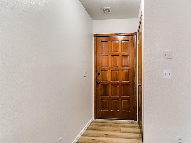 17 Pueblo, Edmond, OK 73013 - doorway to outside with light wood-style floors and baseboards