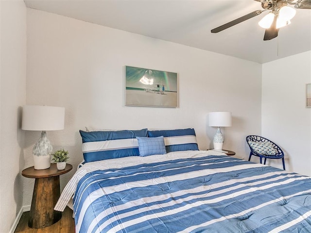 17 Pueblo, Edmond, OK 73013 - bedroom with wood finished floors and a ceiling fan