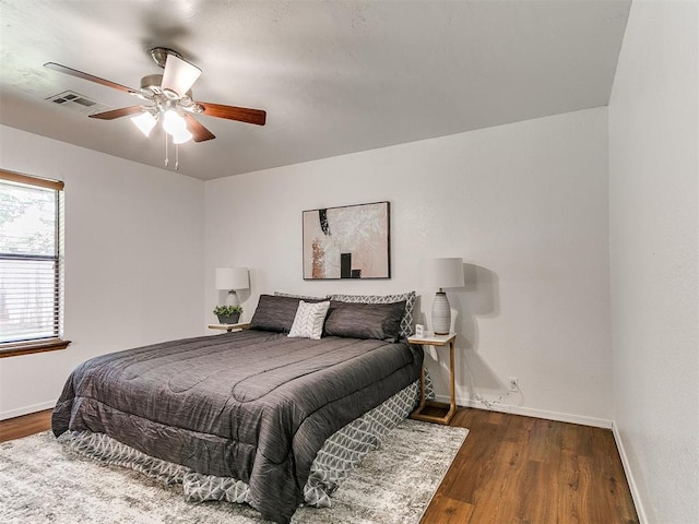17 Pueblo, Edmond, OK 73013 - bedroom featuring wood finished floors and a ceiling fan