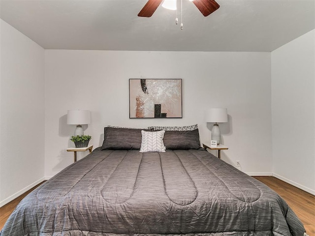 17 Pueblo, Edmond, OK 73013 - bedroom featuring wood finished floors and ceiling fan