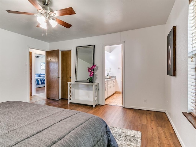 17 Pueblo, Edmond, OK 73013 - bedroom with wood finished floors, ensuite bathroom, and ceiling fan