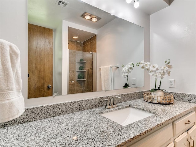 17 Pueblo, Edmond, OK 73013 - full bathroom with vanity and tiled shower