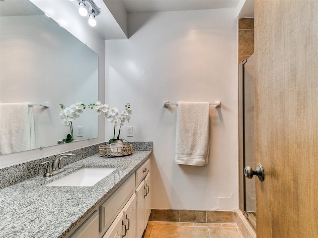 17 Pueblo, Edmond, OK 73013 - full bath featuring vanity, a stall shower, and tile patterned flooring