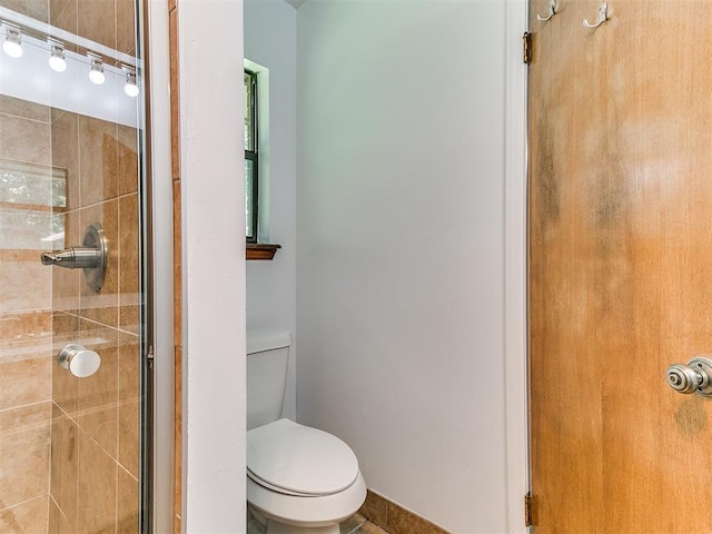 17 Pueblo, Edmond, OK 73013 - full bathroom featuring a stall shower and toilet