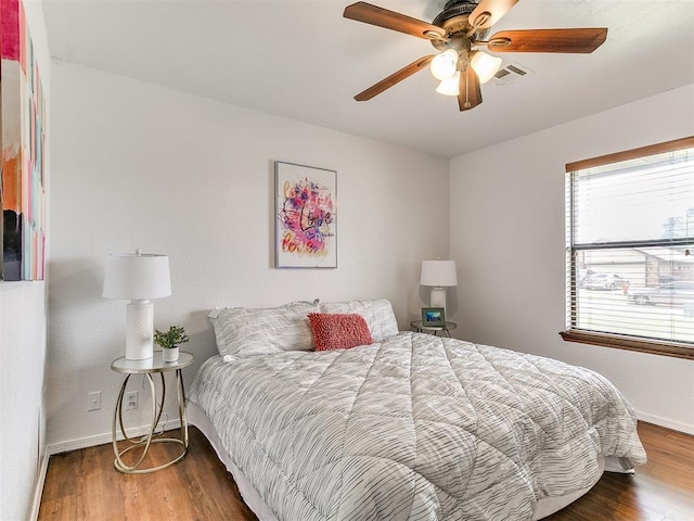 17 Pueblo, Edmond, OK 73013 - bedroom with wood finished floors and ceiling fan