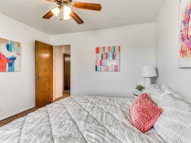 17 Pueblo, Edmond, OK 73013 - bedroom with wood finished floors and ceiling fan