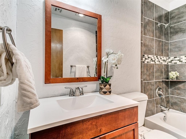 17 Pueblo, Edmond, OK 73013 - full bathroom featuring vanity, a textured wall, and shower / bathtub combination