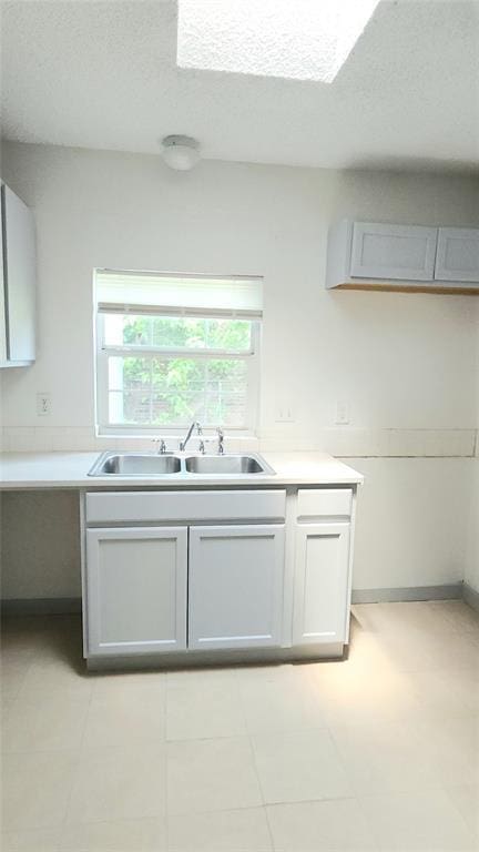 537 NW 114th St, Oklahoma City, OK 73114 - kitchen featuring light countertops and a textured ceiling