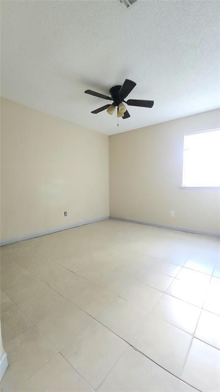 537 NW 114th St, Oklahoma City, OK 73114 - empty room with light tile patterned floors and ceiling fan